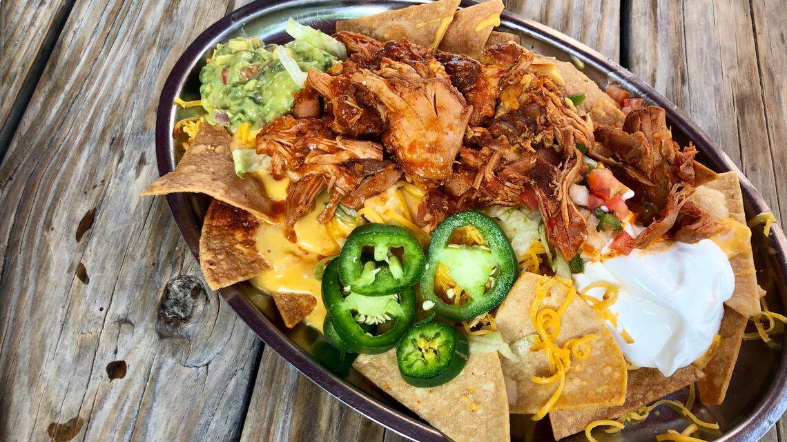 Spicy chicken nachos with fresh jalapenos at the Woodshed Smokehouse.