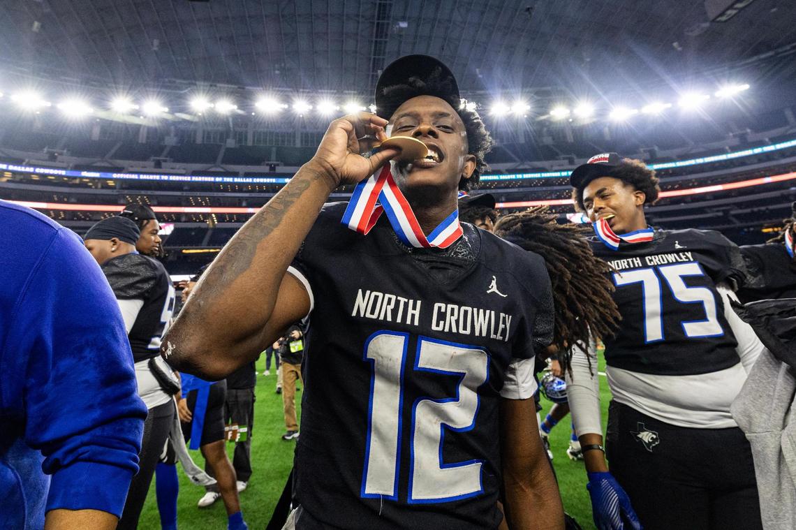 North Crowley quarterback Chris Jimerson (12) celebrates with his medal after winning the UIL 6A Division I state championship game against Austin Westlake at AT&T Stadium in Arlington on Saturday, Dec. 21, 2024.
