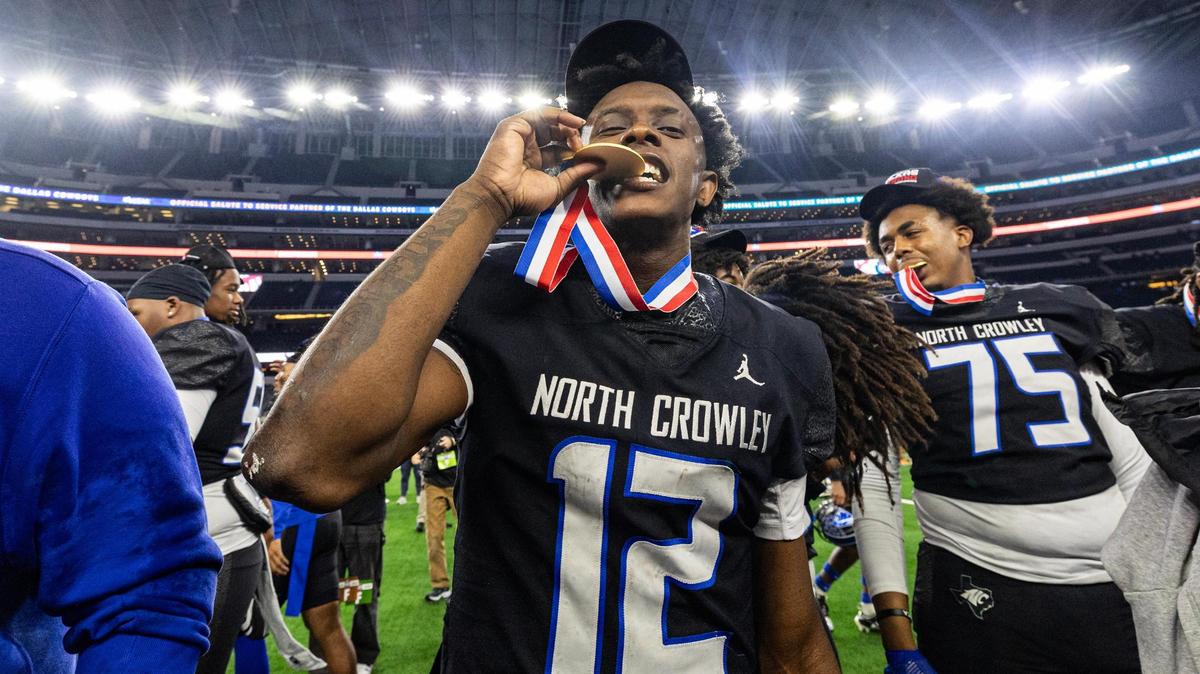 North Crowley quarterback Chris Jimerson (12) celebrates with his medal after winning the UIL 6A Division I state championship game against Austin Westlake at AT&T Stadium in Arlington on Saturday, Dec. 21, 2024.