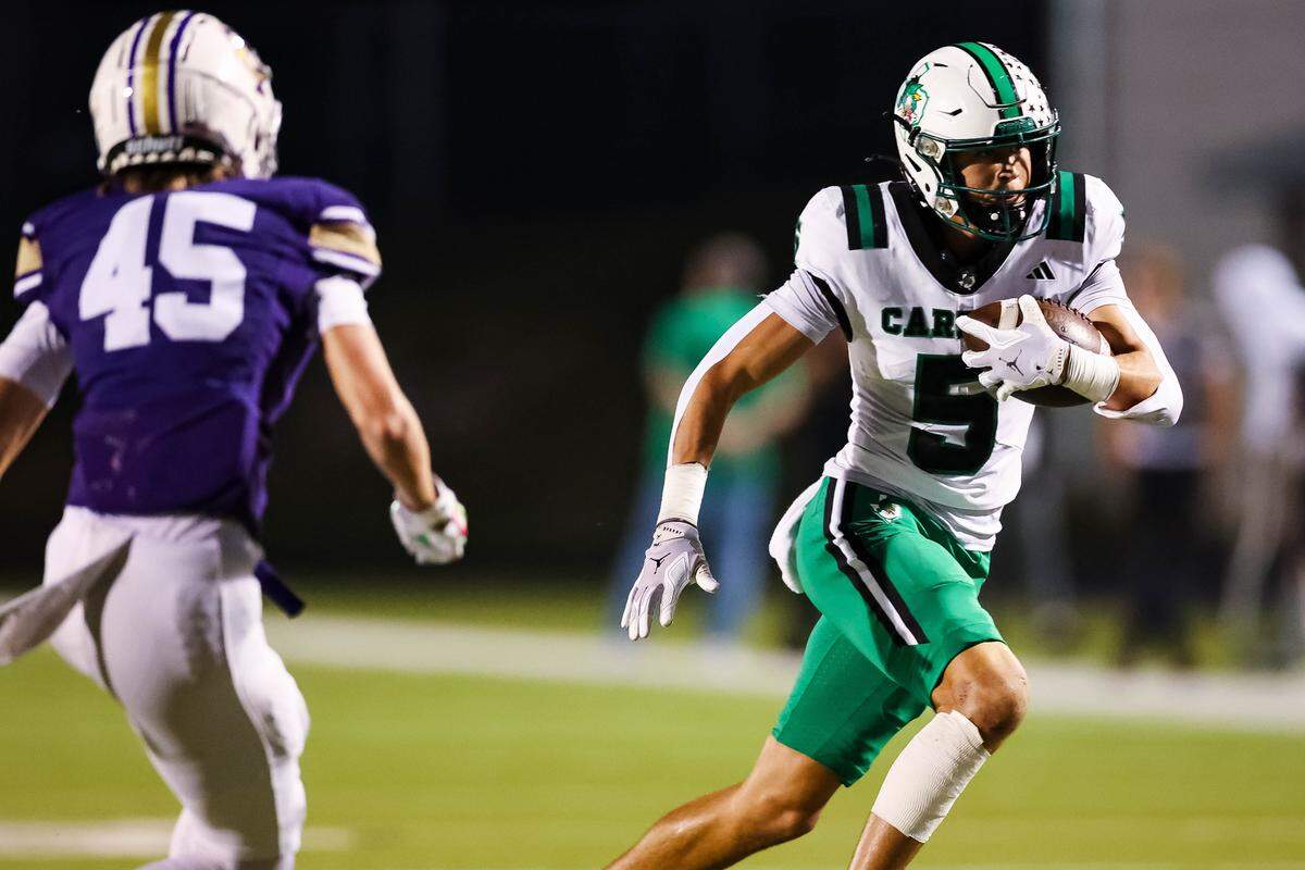 Southlake Carroll wide receiver Blake Gunter (5) runs with the ball after making a catch against Keller Timber Creek’s Chris Ritchie (45) on Thursday, September 25, 2025 at Keller ISD Stadium in Keller, Texas.