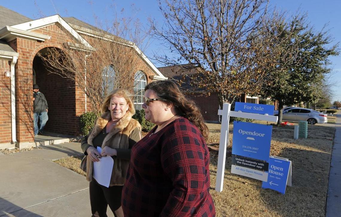 Jill Rooney (right) looks at a house in south Arlington with real estate agent Donna Mendenhall.