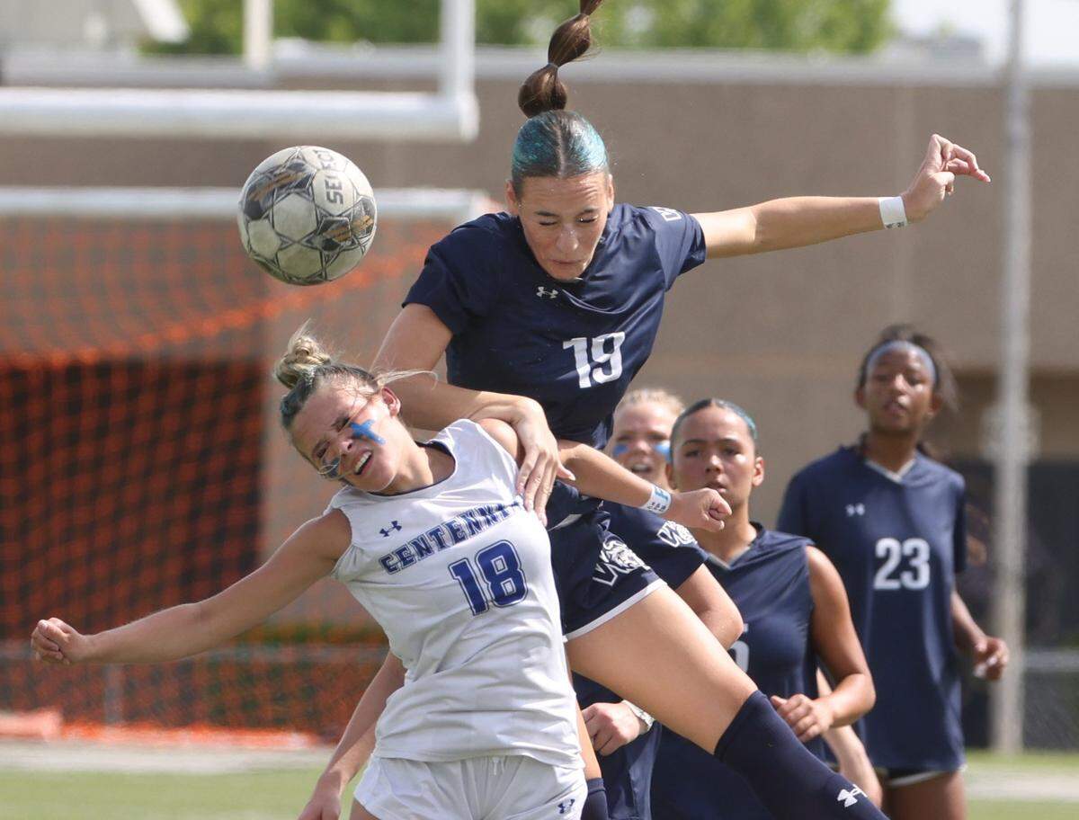 Burleson Centennial forward Hannah Furney (18) and Walnut Grove midfielder Leah Edler (19) go up to battle for the ball during the first half of a UIL Conference 5A Division I state semifinal soccer game at Keller ISD Athletic Complex in Keller, Tx. Friday, April 03, 2026.