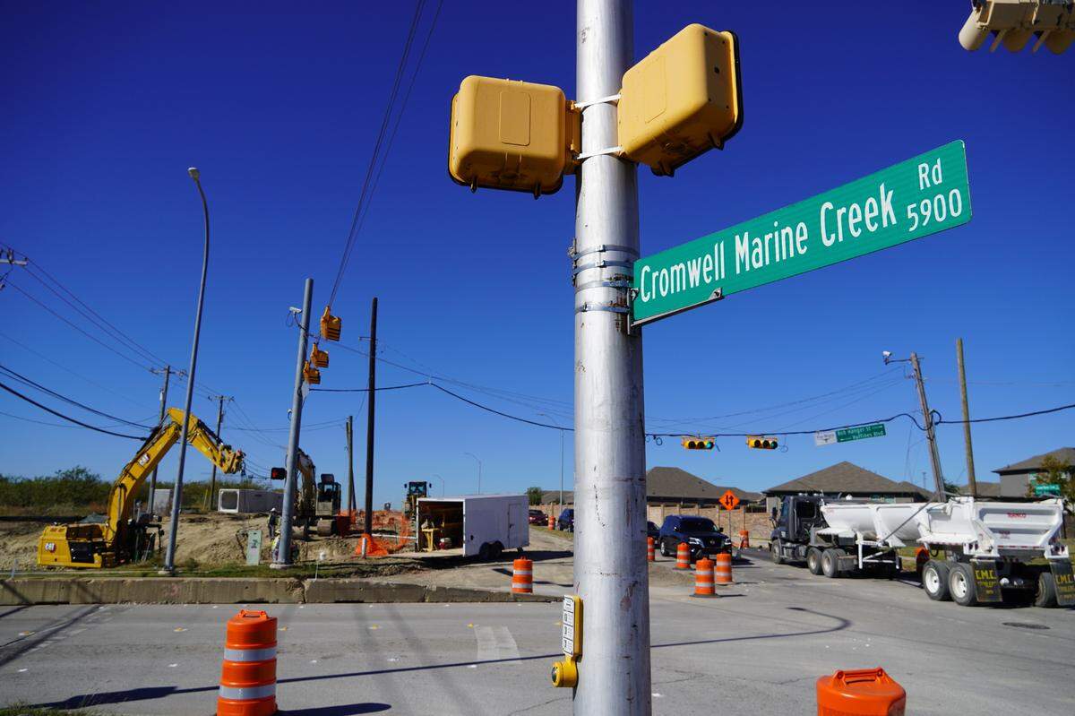 Construction crews working on a $58.4 million rebuild of Cromwell Marine Creek Road in north Fort Worth. The city hopes to wrap up the project by the fall of 2026.