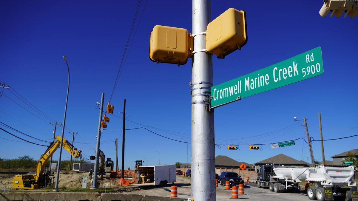 Construction crews working on a $58.4 million rebuild of Cromwell Marine Creek Road in north Fort Worth. The city hopes to wrap up the project by the fall of 2026.