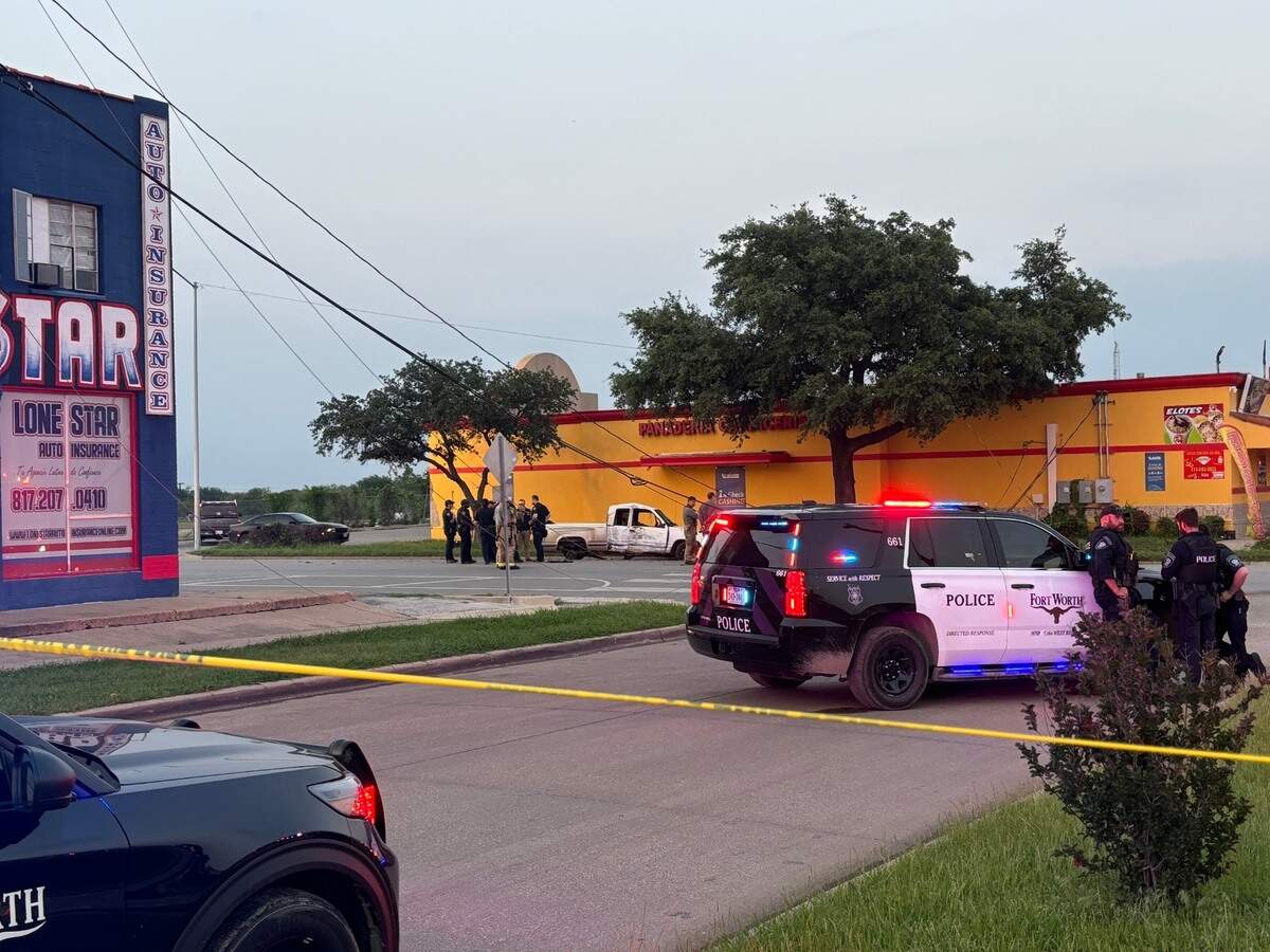 Police officers and firefighters at the scene where injuries were reported following a vehicle crash during a police pursuit on Hemphill Street in south Fort Worth on Monday night, May 6, 2024.