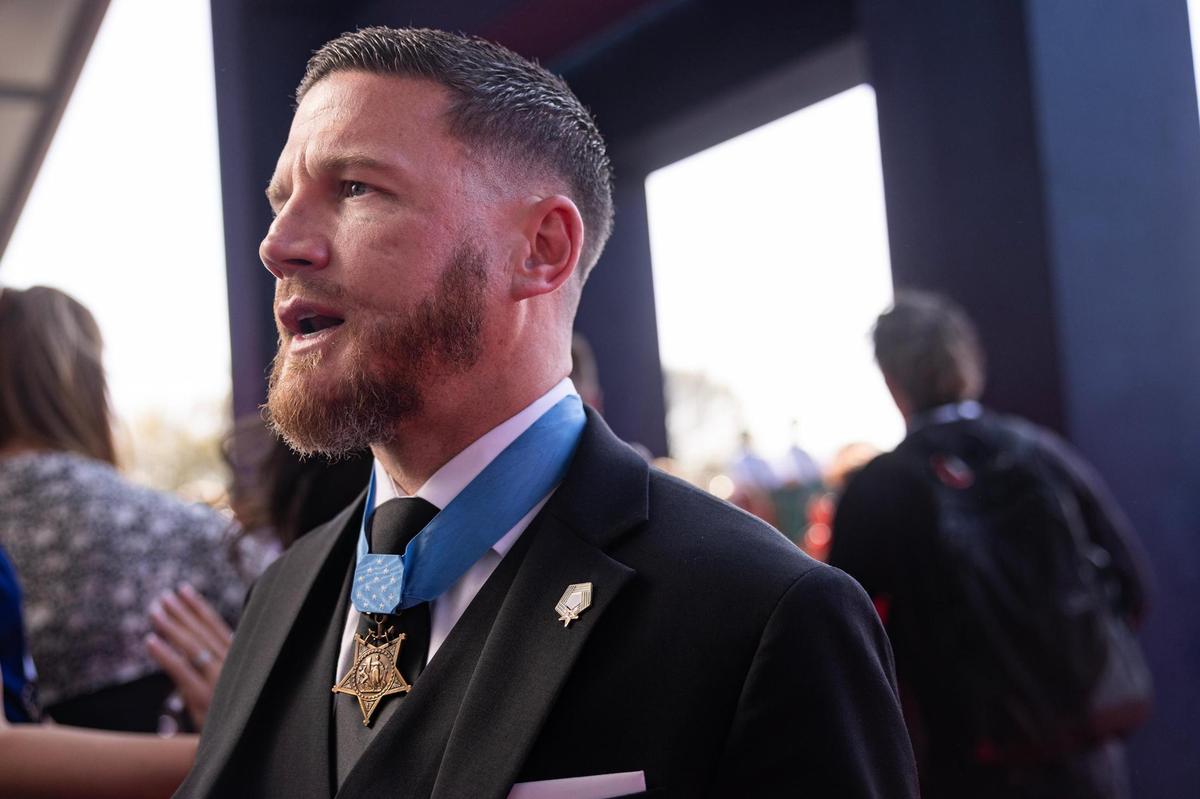 Kyle Carpenter, a medically retired United States Marine and Medal of Honor recipient, speaks to the media on the red carpet for the National Medal of Honor Museum Grand Opening Celebration in the Arlington Entertainment District on Saturday, March 22, 2025. Carpenter is the youngest living Medal of Honor recipient.