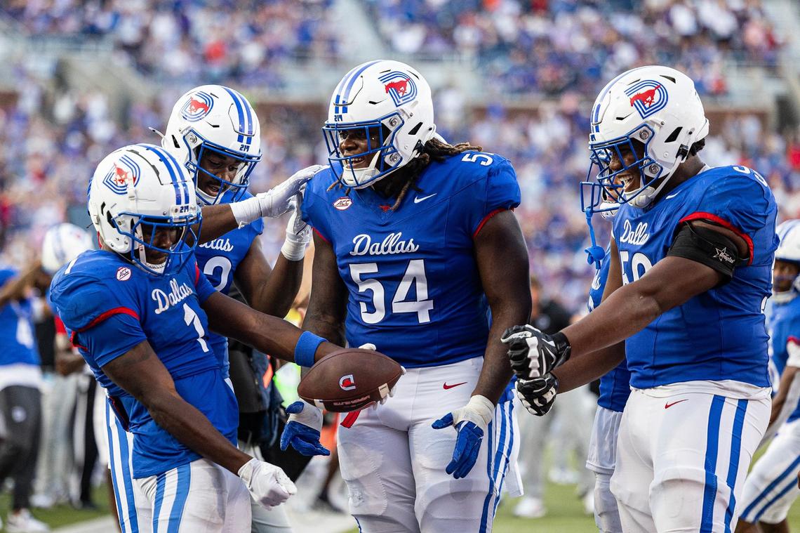 SMU running back Brashard Smith (1) does the cooking in the skillet celebration with his teammates after scoring a touchdown in the third quarter of a non-conference game between TCU and SMU at Gerald J. Ford Stadium in Dallas on Saturday, Sept. 21, 2024.