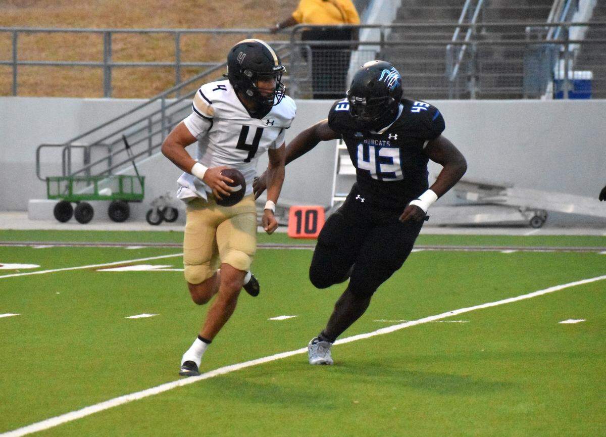 Byron Nelson’s Darryl Ntouba chases Fossil Ridge quarterback Logan Cundiff during Thursday’s game at Northwest ISD Stadium in Justin.
