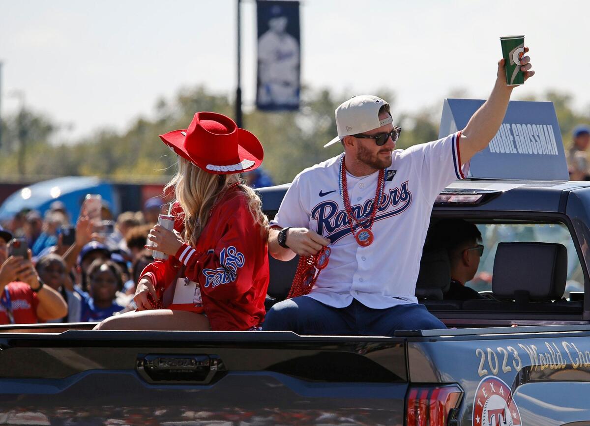 Texas Rangers left fielder Robbie Grossman acknowledges fans during the Texas Rangers World Series Parade in Arlington, Texas, Friday, Nov. 03, 2023. (Special to the Star-Telegram Bob Booth)