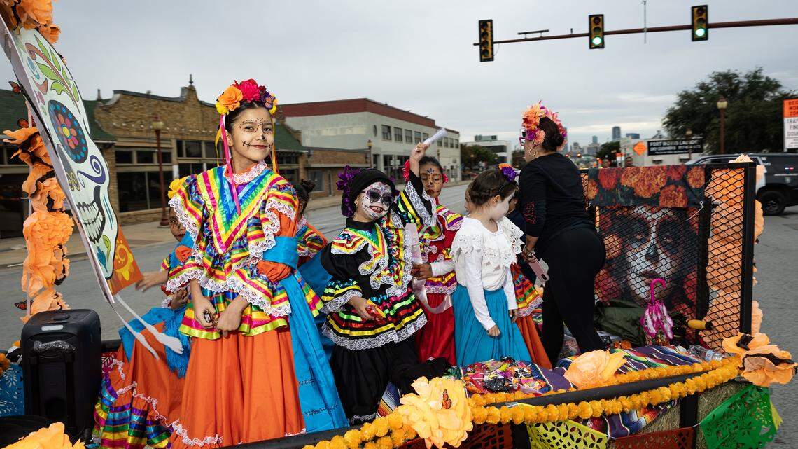 Parade participants ride in their float on Main Street for the Dia De Los Muertos Parade in Northside Fort Worth on Saturday, Nov. 1, 2025.