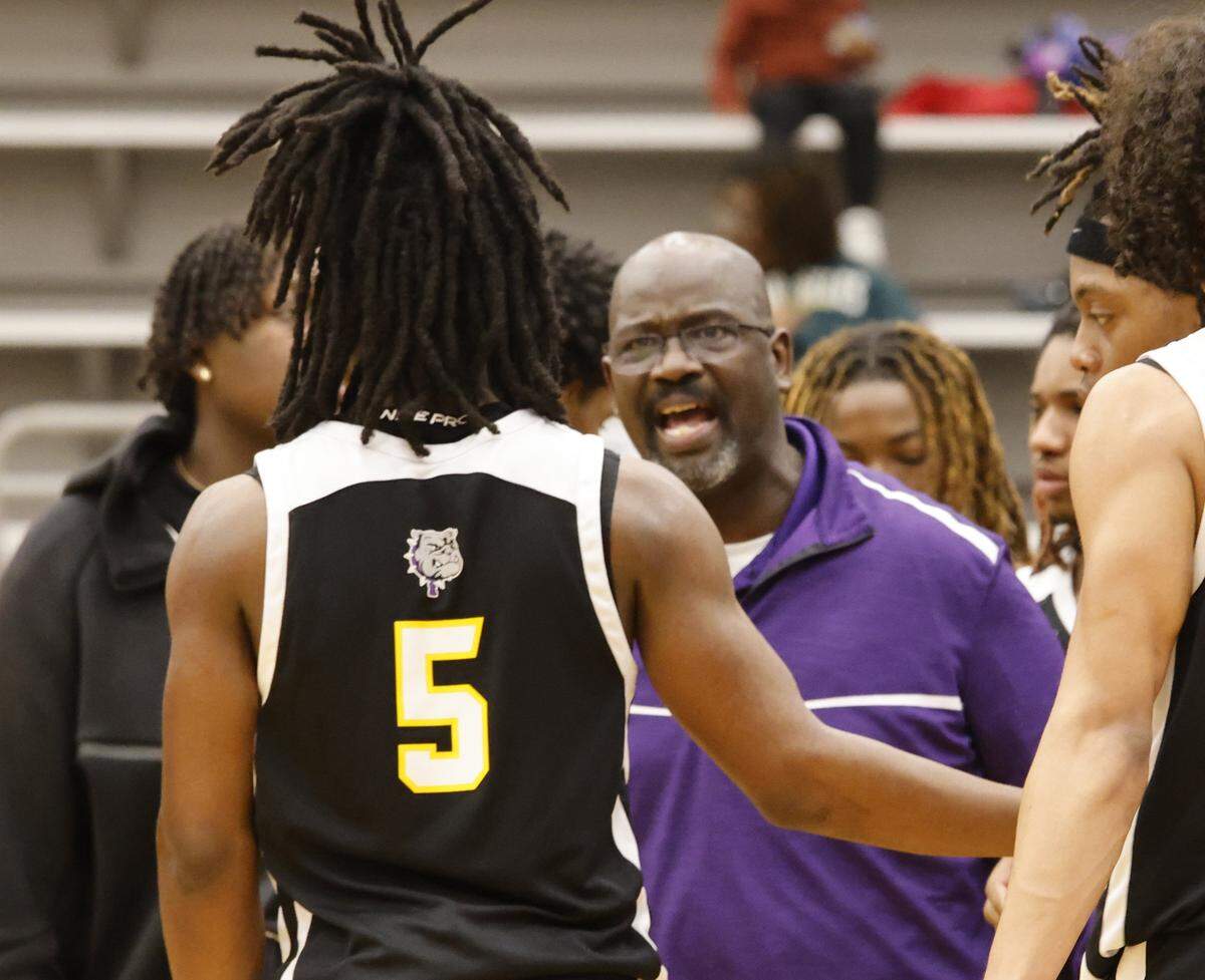 Everman head coach Jon Wagner talks to the players during a timeout against Mansfield Summit during the second half of a UIL boys basketball game between Everman and Mansfield Summit at Summit High School in Mansfield, Texas, Thursday Jan. 22, 2026
