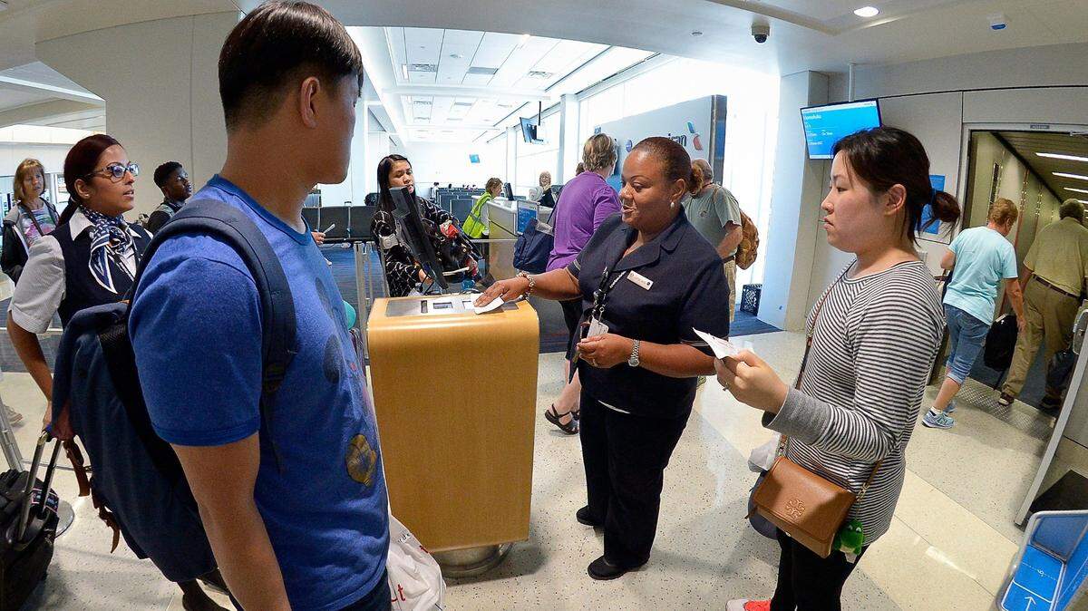 American Airlines gate agents in Terminal A at DFW International Airport in DFW Airport, Texas, Thursday, April 28, 2016.   