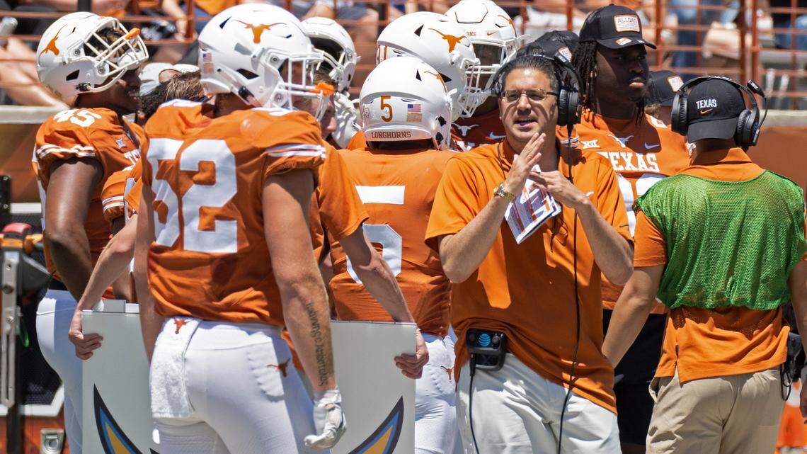 Texas assistant head coach Jeff Banks signals for a timeout during the first half of the Texas Orange and White Spring Scrimmage in Austin, Texas, Saturday, April 24, 2021. (AP Photo/Michael Thomas)
