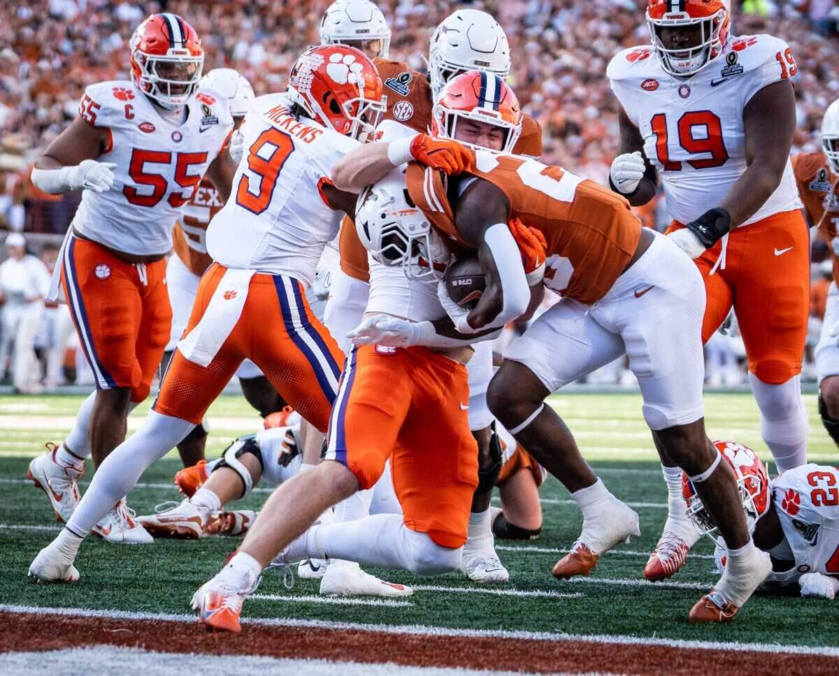 Texas Longhorns running back Quintrevion Wisner (26) carries the ball into the end zone to score the Longhorns’ first touchdown as Texas plays the Clemson Tigers in the first round of the College Football Playoffs at Darrell K Royal Texas Memorial Stadium in Austin, Texas, Dec. 21, 2024.