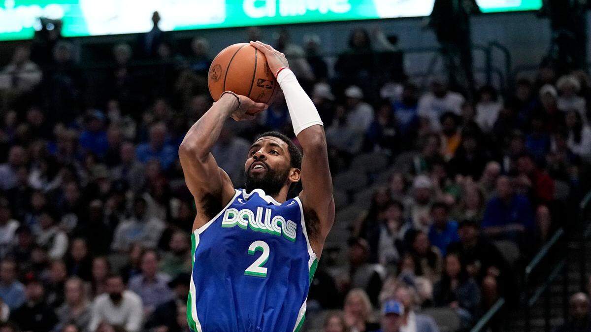 Dallas Mavericks guard Kyrie Irving (2) attempts a shot during an NBA basketball game against the Minnesota Timberwolves, Monday, Feb. 13, 2023, in Dallas.