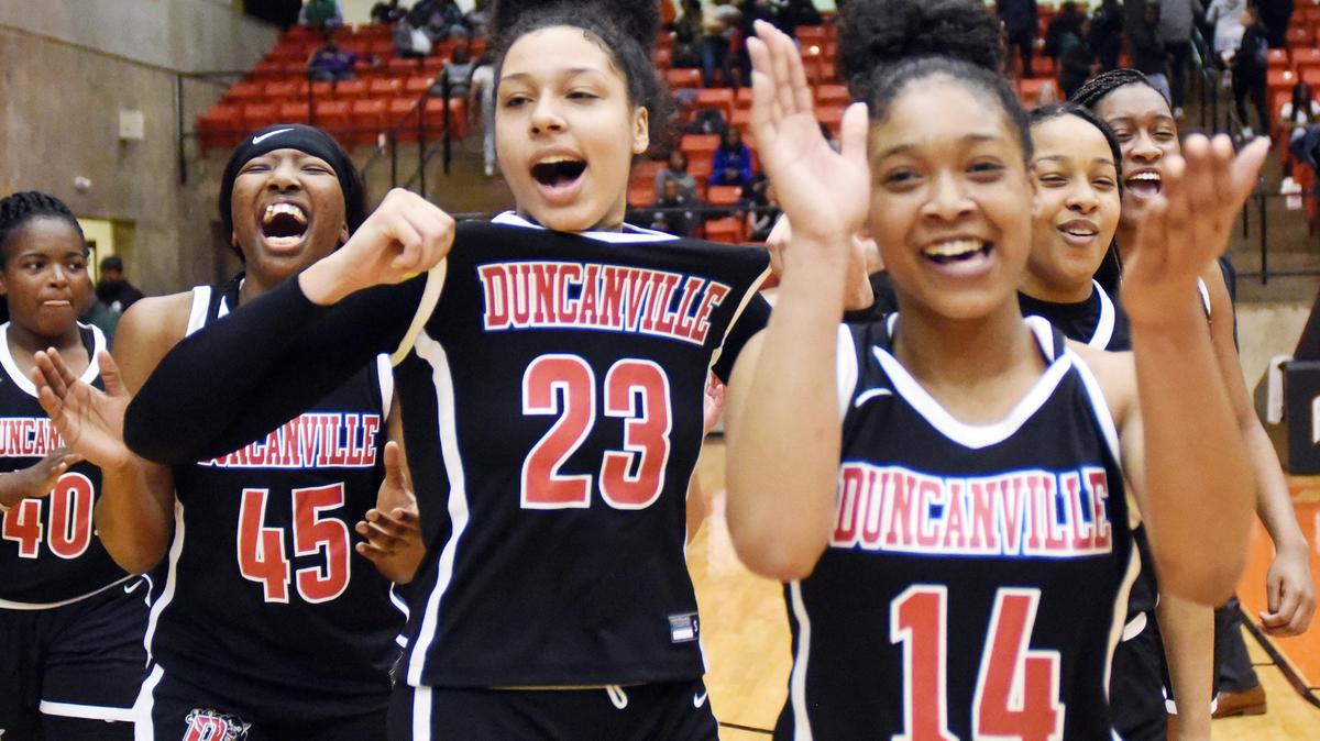 Duncanville’s Laila McLeod, left center and Kiyara Howard-Garza (14) with teammates celebrate the 47-43 win over Desoto in the Regional Quarterfinal Playoff basket ball game Tuesday, February 25, 2020 at Wilkerson Greines Activity Center in Fort Worth. Texas. Special/Bob Haynes