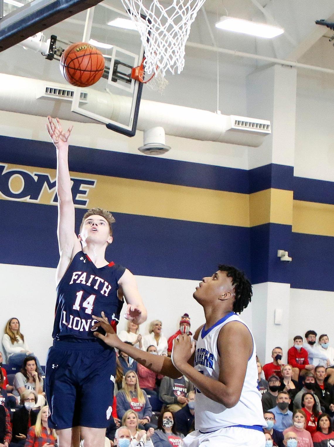Grapevine Faith’s Grant Rein (14) lays up two for the Lions during the TAPPS 5A regional basketball playoff game at Grace Prep in Arlington, Texas, Saturday, March 06, 2021. Grapevine Faith defeated Dallas Christian 52-48. (Special to the Star-Telegram Bob Booth)