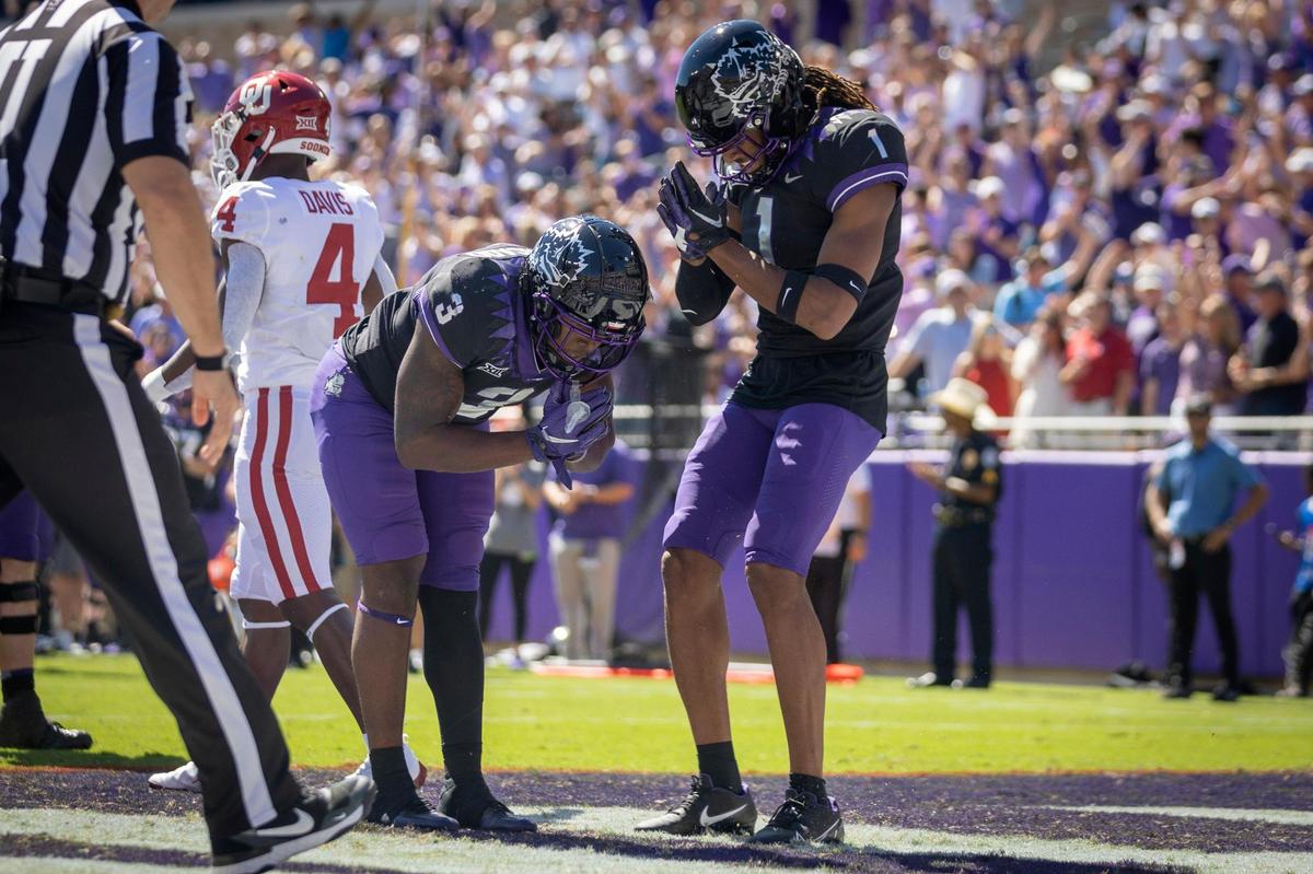 TCU running back Emari Demercado and TCU wide receiver Quentin Johnston react after Demercado scored a touchdown during their game against OU at the Amon G. Carter Stadium in Fort Worth, Texas, on Saturday, Oct. 1, 2022.