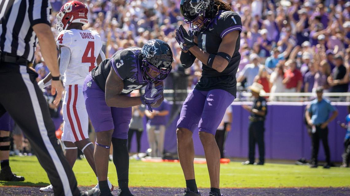 TCU running back Emari Demercado and TCU wide receiver Quentin Johnston react after Demercado scored a touchdown during their game against OU at the Amon G. Carter Stadium in Fort Worth, Texas, on Saturday, Oct. 1, 2022. The Horned Frogs are ranked 17th in the latest AP Poll.