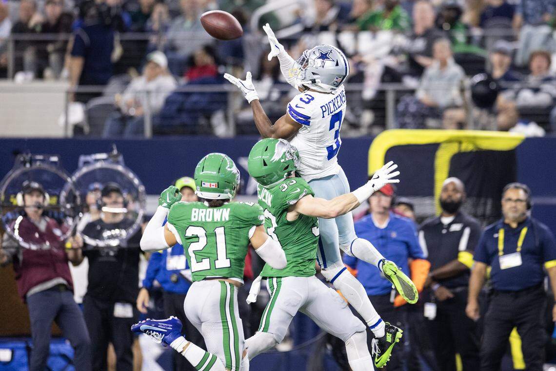 Cowboys receiver George Pickens (3) goes up to catch a pass in the second half of an NFL game between the Dallas Cowboys and the Philadelphia Eagles at AT&T Stadium in Arlington on Sunday, Nov. 23, 2025.