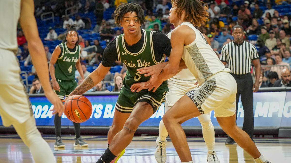 Mansfield Lake Ridge forward Ahmare Rose tries to drive around Plano East’s Jordan Mizell in a Class 6A state semifinal on Friday, March 8, 2024 at the Alamodome in San Antonio, Texas. Plano East downed Lake Ridge 61-45.