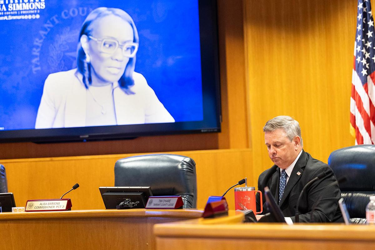 Alisa Simmons, the Tarrant County Commissioner of Precinct 2, and Tim O’Hare, the Tarrant County Judge, listen to lawyer Joe Nixon address the questions regarding the proposed redistricting of the county during a Commissioners Court Meeting at the Tarrant County Administration Building in Fort Worth on Tuesday, May 6, 2025.
