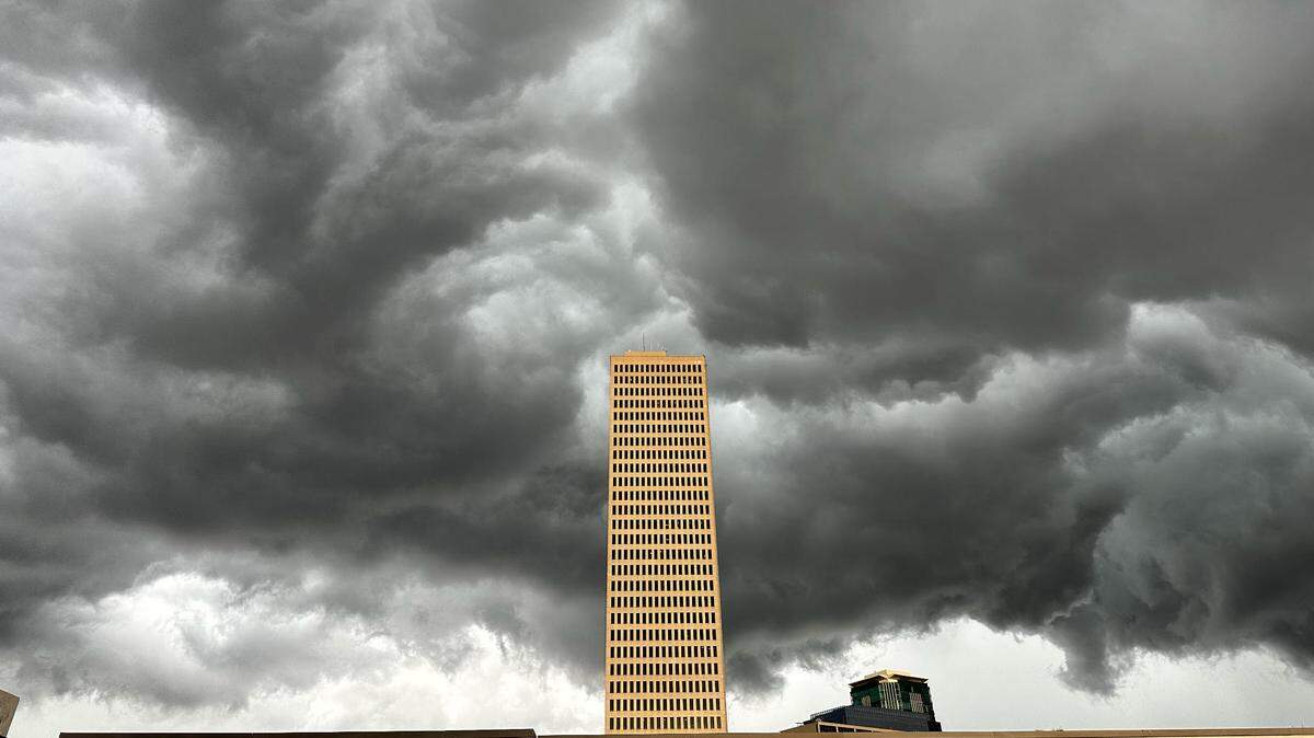 Dark clouds appear above the Burnett Plaza tower.