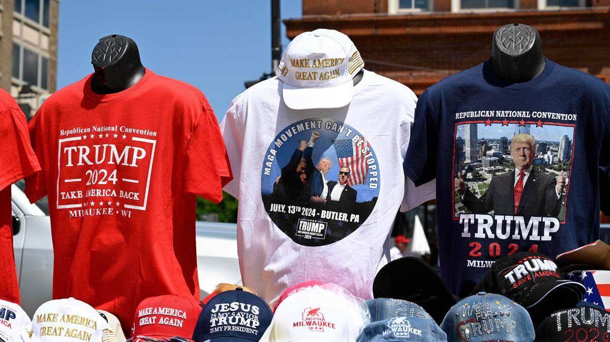 Jul 17, 2024; Milwaukee, WI, USA; A T-shirt featuring an image of Republican presidential nominee Donald J. Trump from the day he was shot is seen for sale by a street vendor during the third day of the Republican National Convention at Fiserv Forum. The third day of the RNC featured a feature on foreign policy and threats. Mandatory Credit: David Baratz-USA TODAY