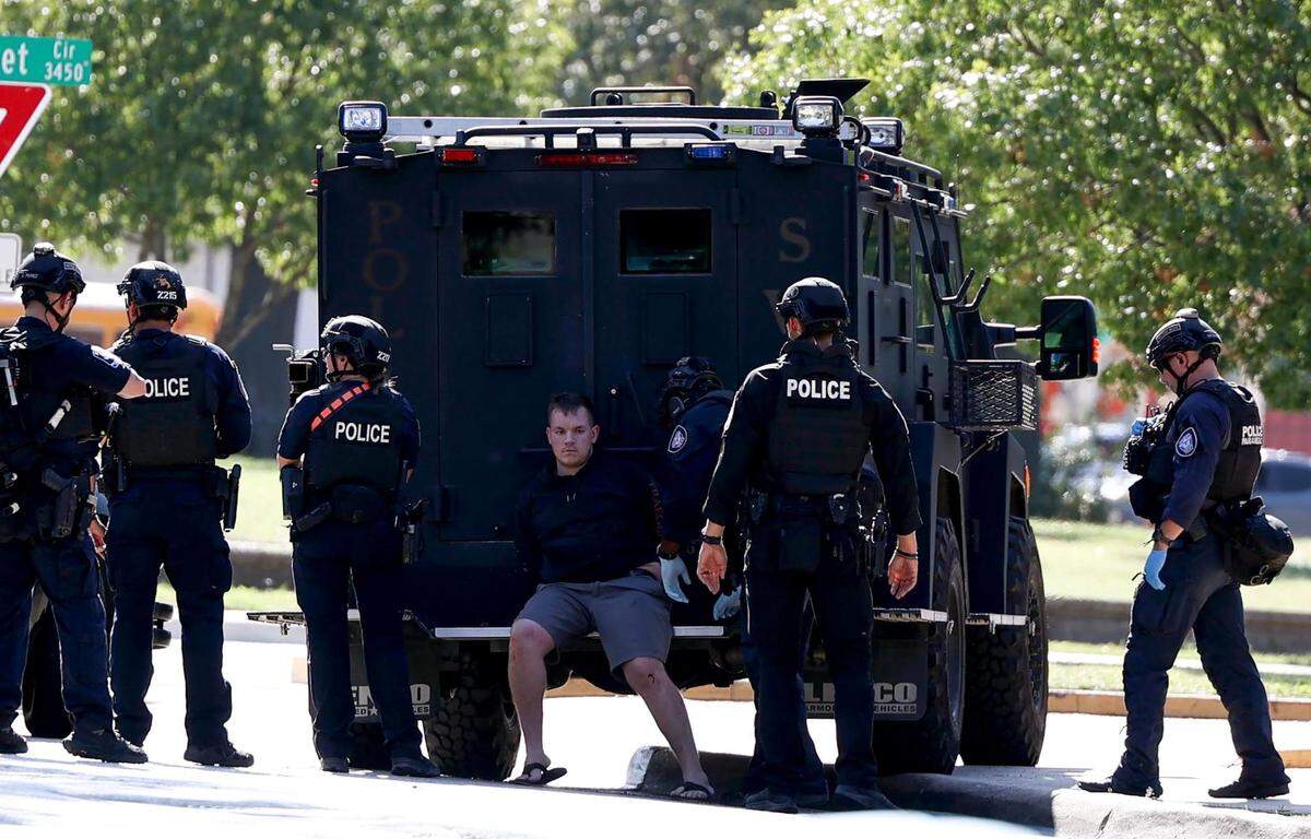 Members of the Fort Worth Police Department detain a suspect accused of firing a gun in the air outside businesses on Bluebonnet Circle on Thursday, October 12, 2023, in Fort Worth.