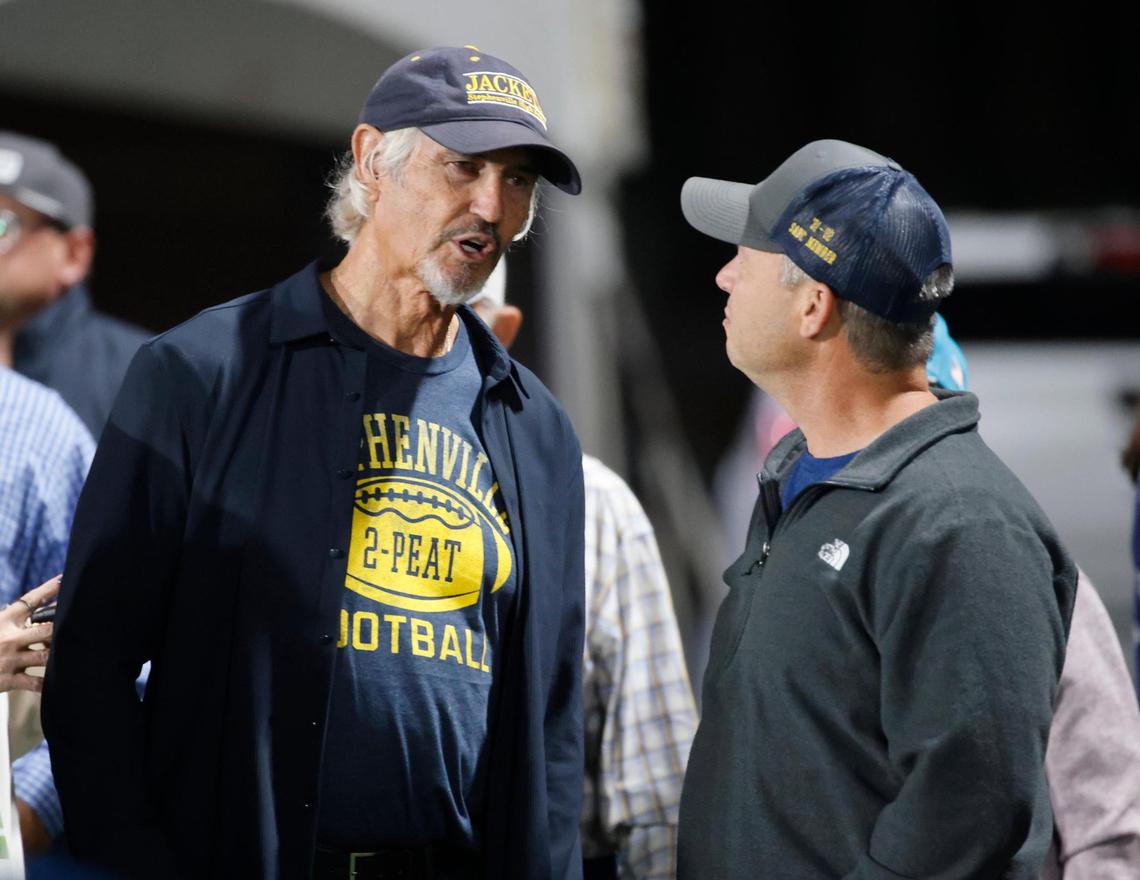 Former Stephenville head coach Art Briles talks with Mark Blackburn who played for Briles on the 91-92 team during a UIL District 4-4A D1 football game at Tarleton State Memorial Stadium in Stephenville, Texas, Friday, Nov. 01, 2024.