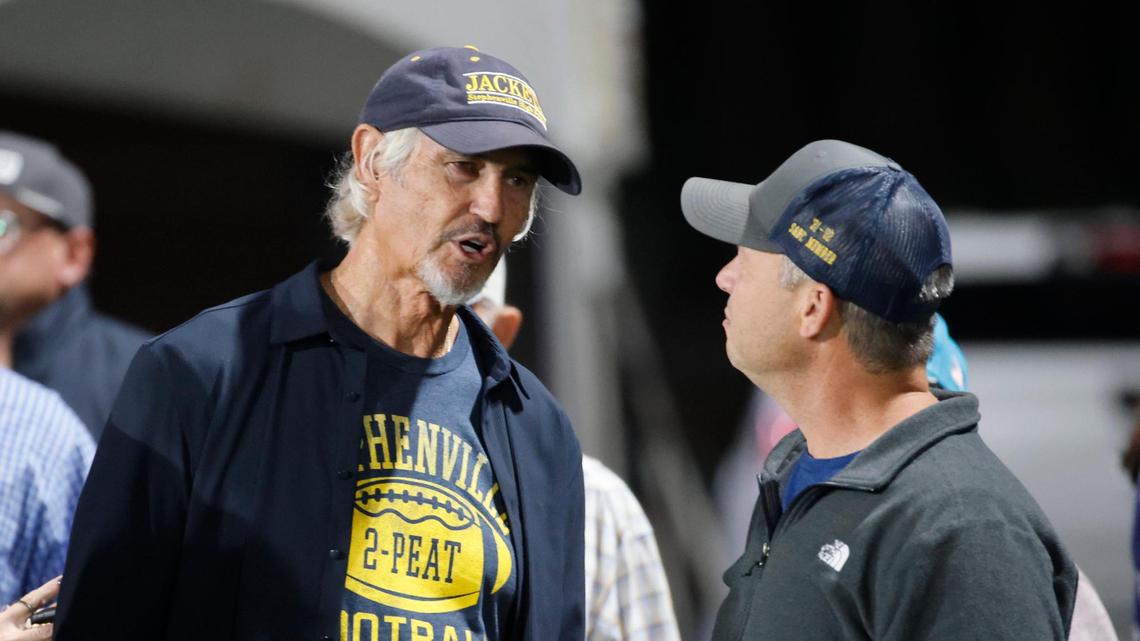 Former Stephenville head coach Art Briles talks with Mark Blackburn who played for Briles on the 91-92 team during a UIL District 4-4A D1 football game at Tarleton State Memorial Stadium in Stephenville, Texas, Friday, Nov. 01, 2024.