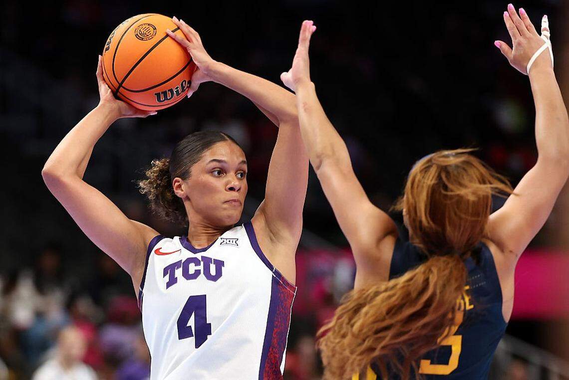 KANSAS CITY, MISSOURI - MARCH 08: Donovyn Hunter #4 of the TCU Horned Frogs controls the ball as Gia Cooke #3 of the West Virginia Mountaineers defends during the championship game of the 2026 Big 12 Women's Tournament at T-Mobile Center on March 08, 2026 in Kansas City, Missouri. (Photo by Jamie Squire/Getty Images)