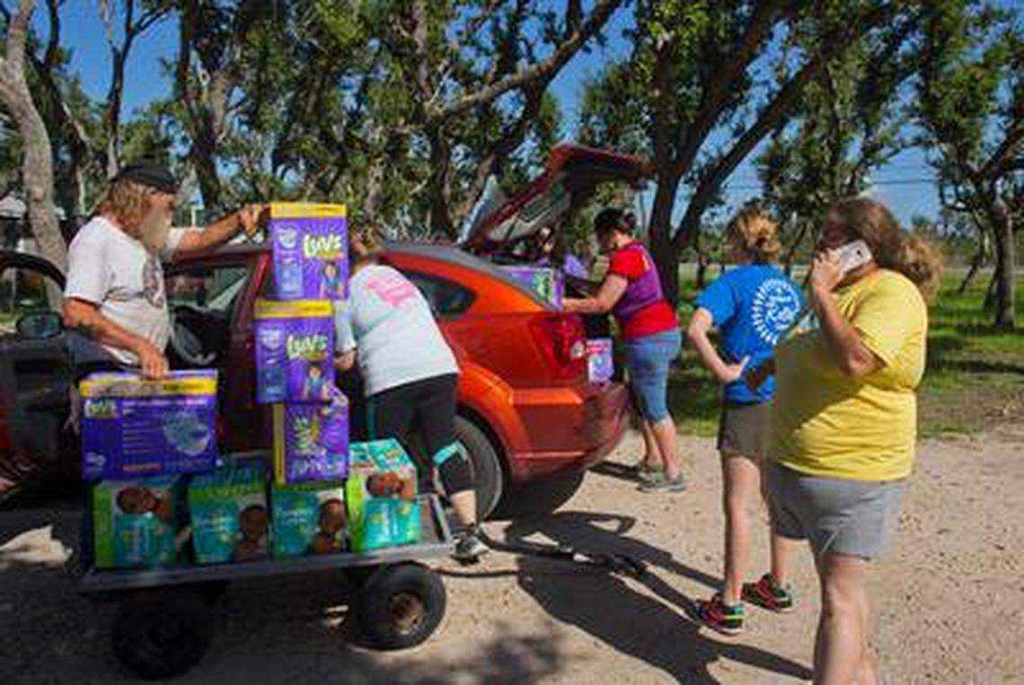 Rockport Relief Camp volunteers load boxes of diapers for a daycare center that cares for children of families affected by Hurricane Harvey on Friday, July 13, 2018. Samantha McCrary opened up her land in Rockport as a refugee camp after Harvey hit the area. It’s now a distribution center for people who will still need supplies and food.