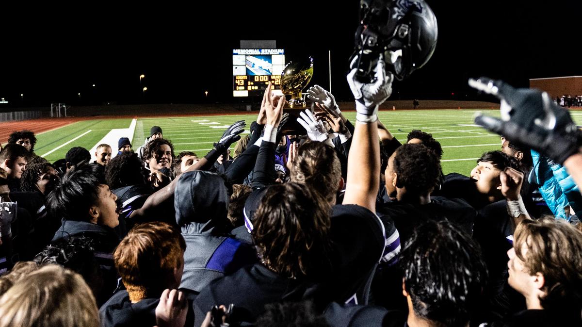 Frisco Independence celebrates with the bi-district trophy after beating Mansfield Timberview 43-28 at Memorial Stadium in Frisco, Texas, Thursday, Nov. 14, 2019.