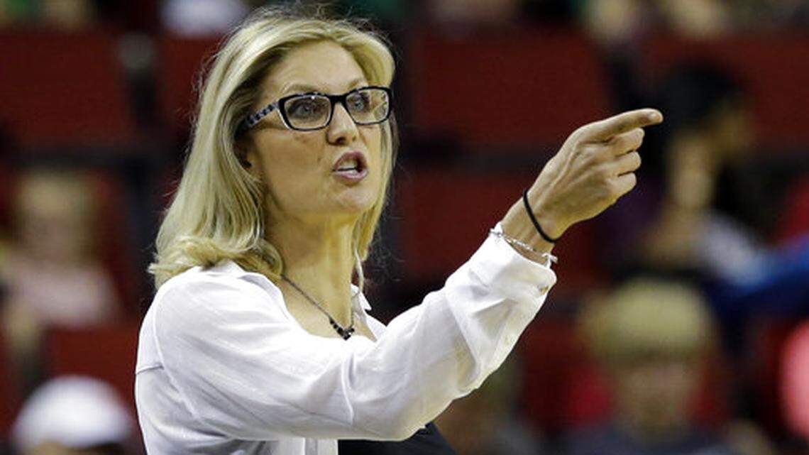 Former Seattle Storm head coach Jenny Boucek, who has just been hired to be an assistant coach for the Dallas Mavericks, gestures during a WNBA game against the Connecticut Sun, in Seattle. (AP Photo/Elaine Thompson, File)