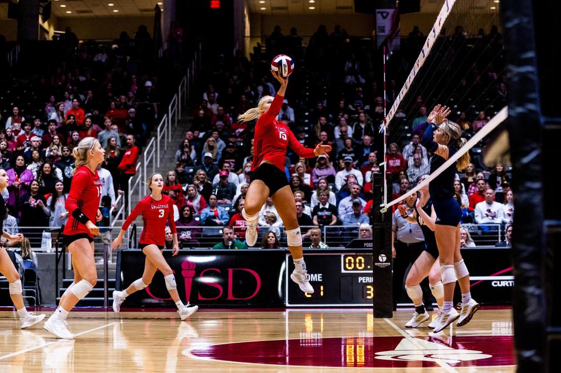 Reagan Engler (15) tips the ball during the 5A state semifinal between Colleyville Heritage and Montgomery Lake Creek at the Curtis Culwell Center in Garland on November 18th, 2022.
