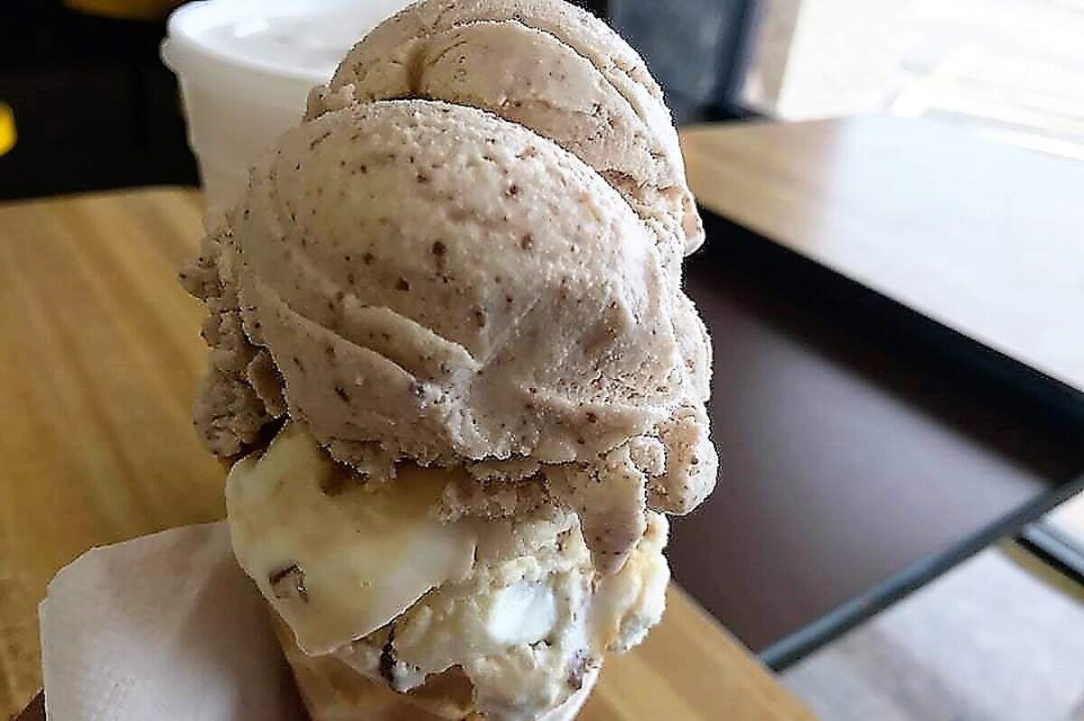 Carlos V, top, a flavor based on a brand of Mexican chocolate bar, and caramel con nuez scoops at Paleteria La Azteca in Haltom City
