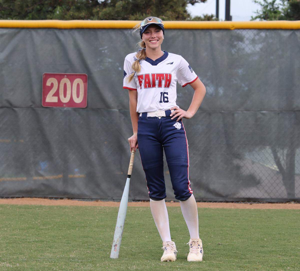 Grapevine Faith center fielder Michaela Hamilton is photgraphed in center field after winning a softball game at Oak Grove Park in Grapevine, Tx. Tuesday, March 31, 2026