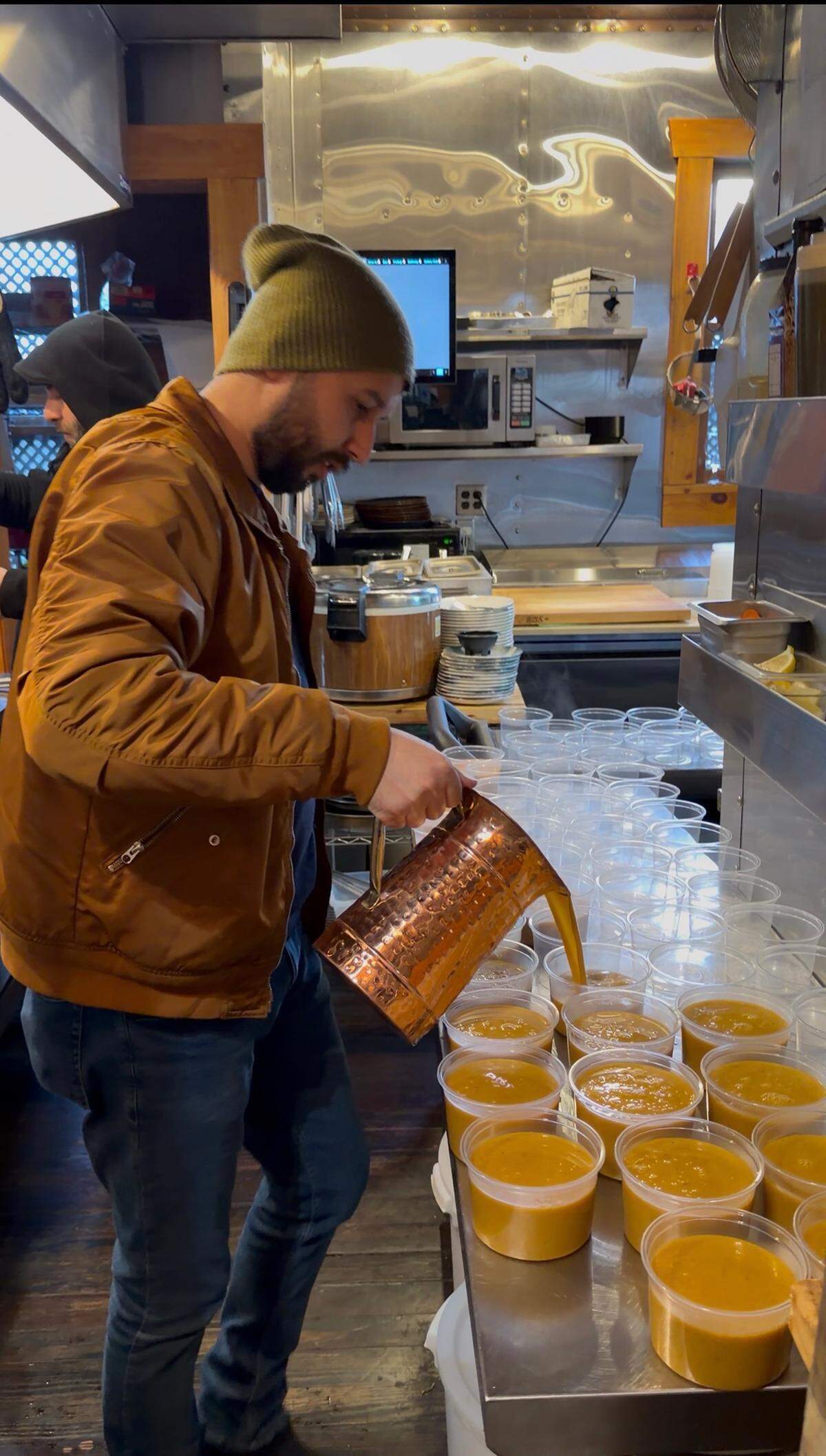Chef Can Karatas helps serve soup to people in need during this week’s winter storm and extreme cold.