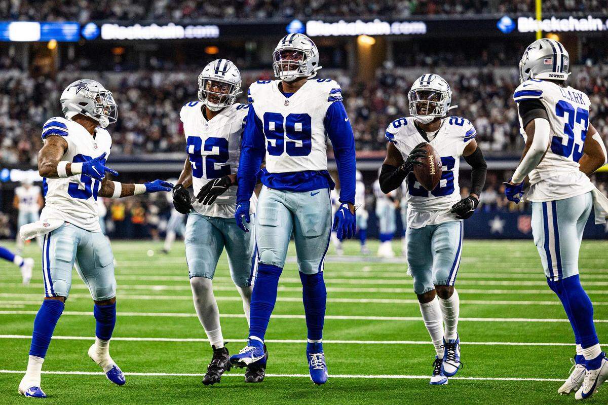 Members for the Dallas Cowboys defense comes to the end zone to celebrate an interception by cornerback DaRon Bland (26) in the second half of an NFL game between the Dallas Cowboys and New England Patriots at AT&T Stadium in Arlington on Sunday, Oct. 1, 2023. The Cowboys defeated the Patriots 38-3.