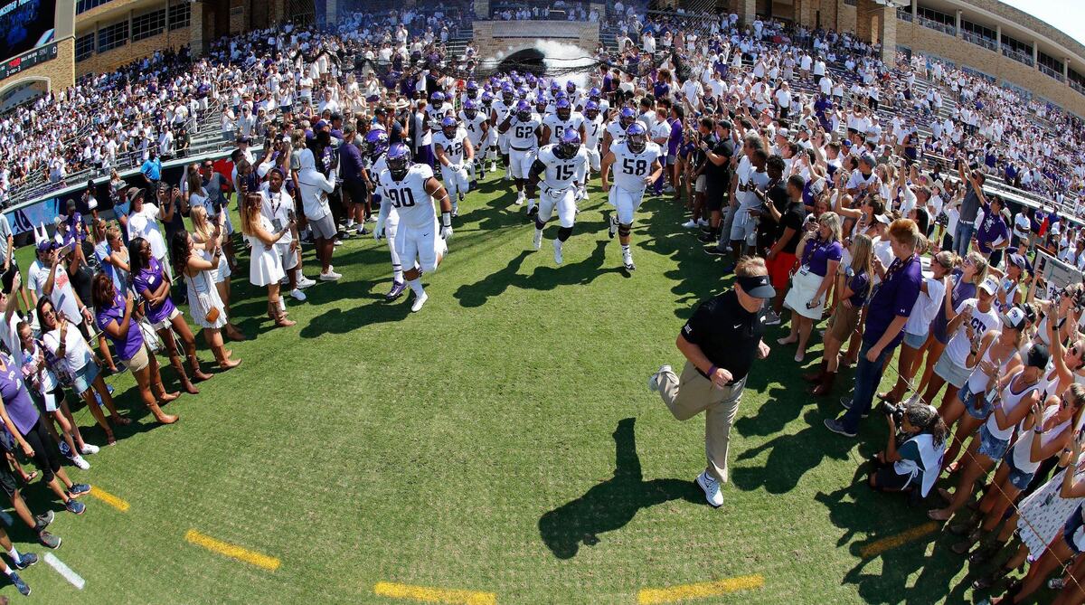 TCU head coach Gary Patterson leads his team on to the field before SMU and play TCU in their annual Iron Skillet game in Fort Worth, Saturday, September 16, 2017. TCU beat SMU 56-36.
