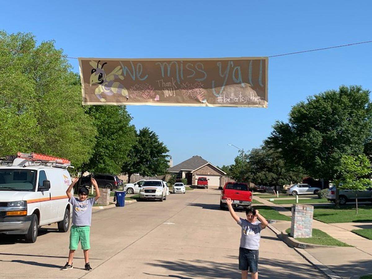 Clinkscale Elementary students and families lined up outside their homes on Thursday April 23, 2020 for the Clinkscale Crusade Parade to see teachers and principals drive by.