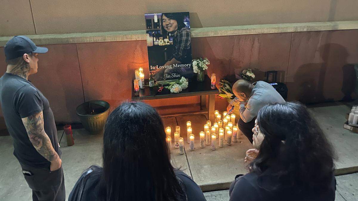 Hundreds of people showed up Thursday night to a candlelight vigil and wake honoring Jin Shin, the man shot and killed after a car crash in Fort Worth early Monday morning. They described him as one of the key people in the Dallas Asian-American community who used his business, Family Karaoke, as a place to bring people from all walks of life together.