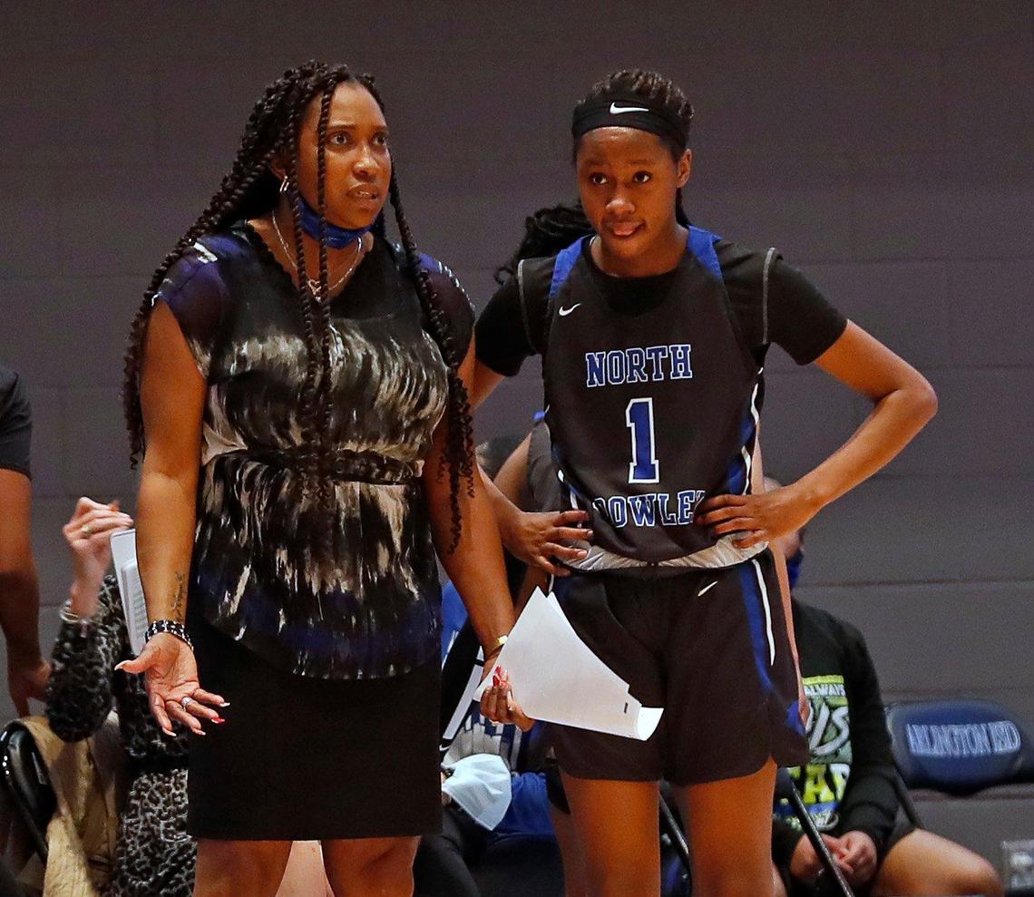North Crowley head coach Lori Shead talks to guard Alaina Payne (1) during the first half of a Division 6A Region 1 quarterfinal basketball game at Arlington ISD Complex in Arlington, Texas, Thursday, Feb. 25, 2021. Keller led 31-26 at the intermission. (Special to the Star-Telegram Bob Booth)