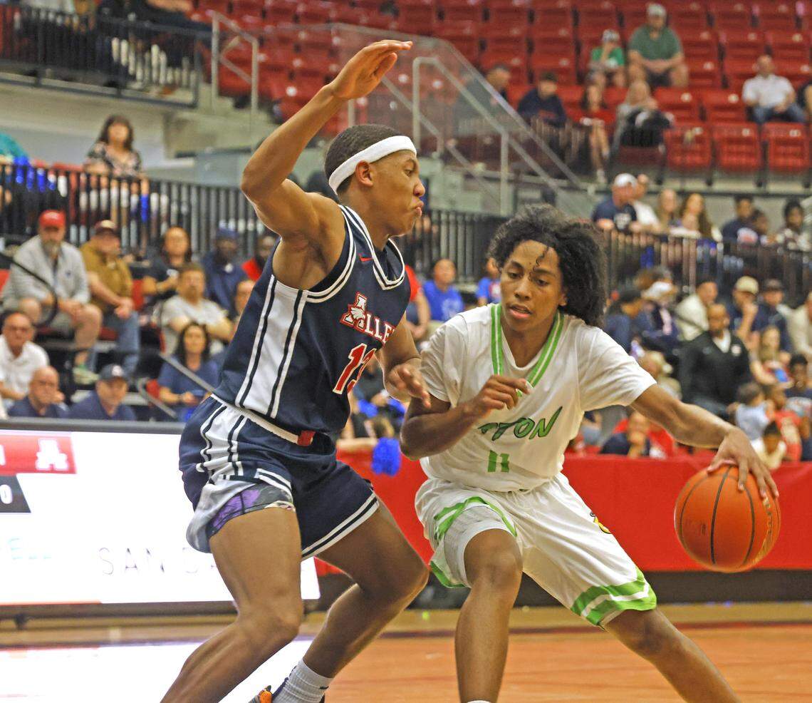 Eaton guard D’Andre Goodman (11) pushes Allen’s Bennett Mosley (13) into the paint during a UIL Class 6A Division I boys regional semifinal basketball game at Coppell High School in Coppell, Texas, Tuesday, Mar. 03, 2026.