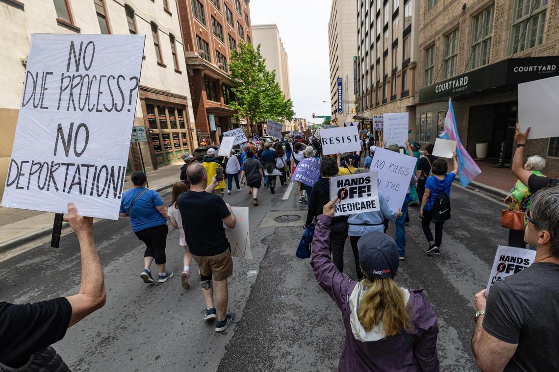 Thousands of protestors march down West 5th Street for the national ‘Hands Off’ protest movement in downtown Fort Worth on Saturday, April 19, 2025.