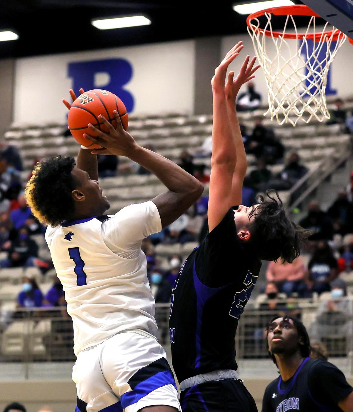 North Crowley forward Marques Sales (1) shoots over Byron Nelson guard Conner Lindsey (R) during the first half, Friday, February 26, 2021 of a 6A Region 1 Quarterfinal High School playoff Basketball game played at the Thomas Coliseum in Haltom City, Tx. (Steve Nurenberg Special to the Star-Telegram)