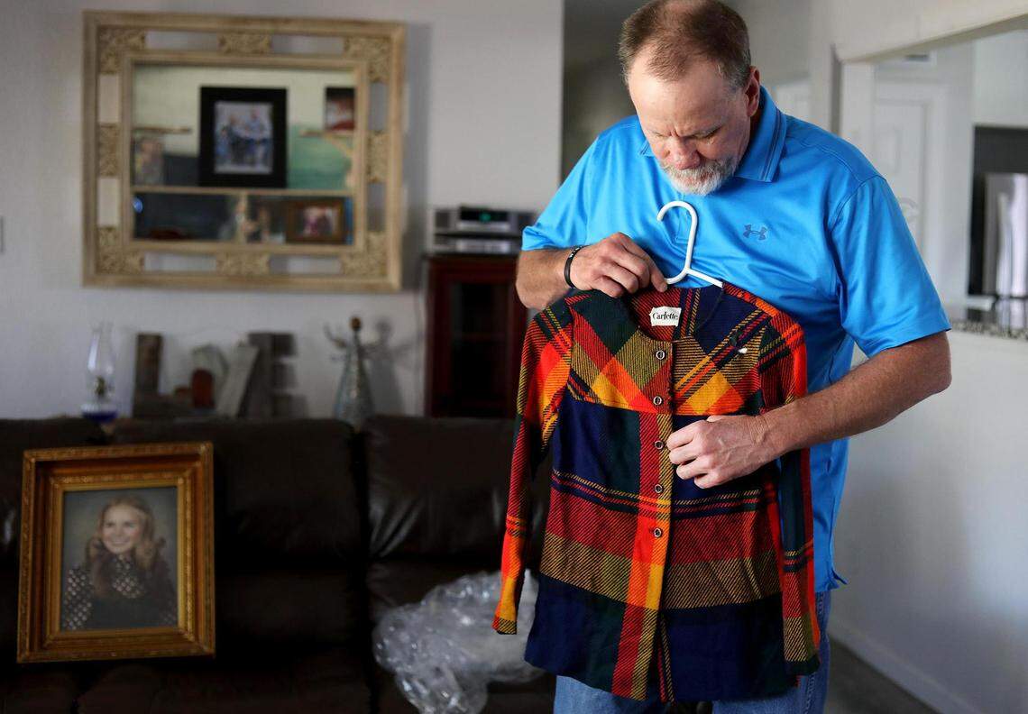Jim Walker holds a jacket that once belonged to his sister, Carla Walker. He says it has hung in his closet for years and that he’d touch it everyday as a reminder of his sister and his pursuit of justice in her murder.