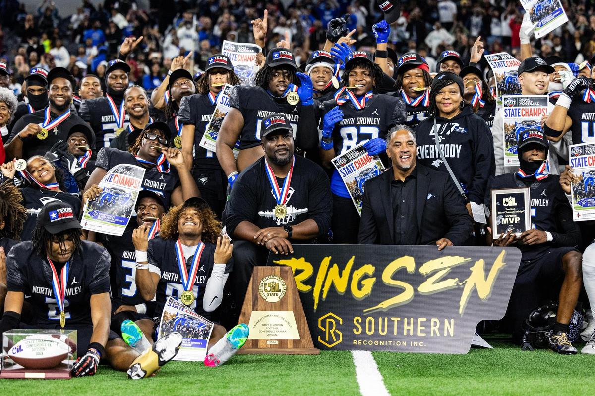 The North Crowley Panthers football team poses with the trophy and their medals after winning the UIL 6A Division I state championship game against Austin Westlake at AT&T Stadium in Arlington on Saturday, Dec. 21, 2024.