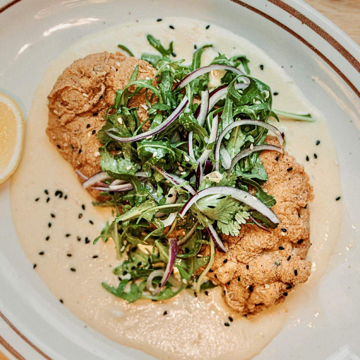 Chicken milanesa with elote velouté at Loma TXMX.